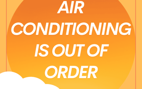 Orange sign with white text reads, 